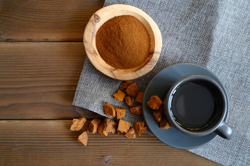 chaga tea mushroom from birch tree using for healing tea or coffee in folk medicine. ground powder
