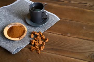 chaga tea mushroom from birch tree using for healing tea or coffee in folk medicine. ground powder