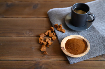 Obraz na płótnie Canvas chaga tea mushroom from birch tree using for healing tea or coffee in folk medicine. ground powder