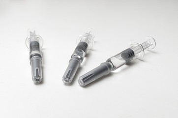 Generic prefilled vaccine syringes. Close-up studio shot.