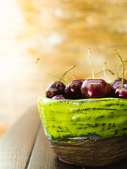 Bowl of cherries on a table