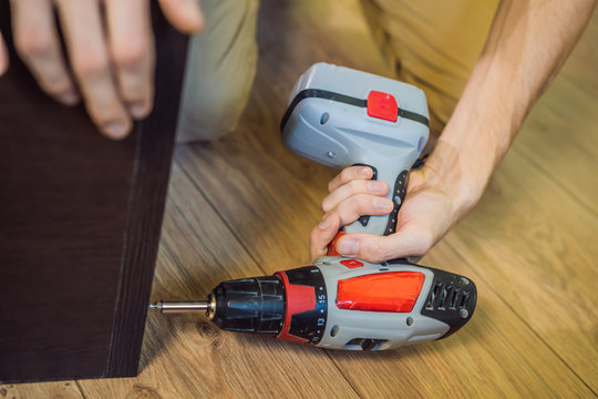 Frustrated Man Putting Together Self Assembly Furniture