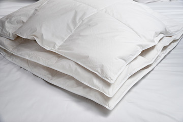 White blanket (quilt) on the bed
