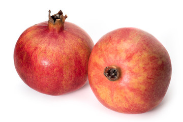 Ripe pomegranate isolated on a white background