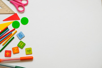Fototapeta premium Math concept: colorful pens and pencils, number, calculating sticks in white background, copy space