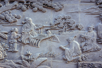 Wall decoration on a exteriors of building in historic residential area called hutong in Beijing, capital city of China