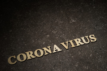 Word coronavirus on stone texture background 