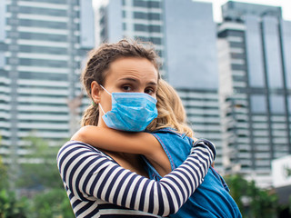 Parent hugs the child. Fighting the 2019-nCoV Virus Outbreak