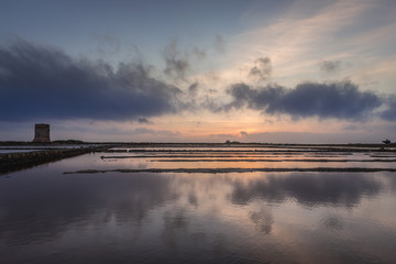 Nubia saltworks nature protected area in Nubia village near Trapani city on Sicily Island in Italy, view with small historic tower