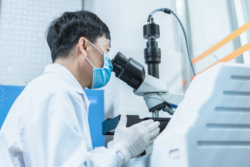 Doctor is using microscope to observe samples