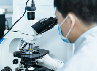 Doctor is using microscope to observe samples
