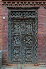 Wooden carved door in a temple at Durbar Square, Bhaktapur, Nepal