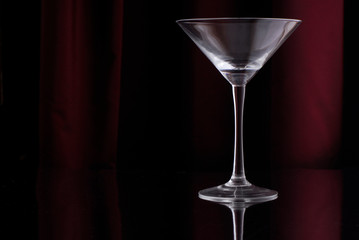 empty martini glass on black background