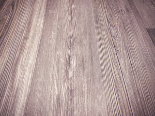 Wooden background made of natural wood with pattern of lines and knot used in flooring with rough surface with rustic brown color