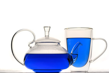 Cup and teapot butterfly pea flower blue tea. Healthy detox herbal drink.