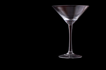 empty martini glass on black background