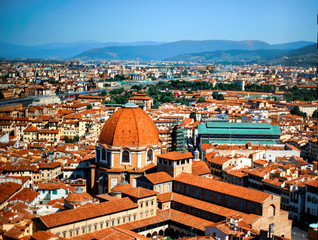 Fototapeta na wymiar View on city of Florence, Tuscany, Italy and Cattedrale di Santa Maria del Fiore from campanile. Popular tourist attraction. Famous place in heart of Europe. Florence on of most popular italian city