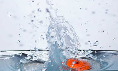 Water splashes against a blue background