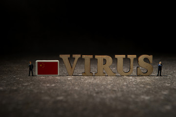 Word virus with China flag on black background 