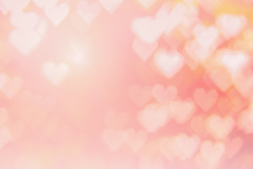 Blurred background of Valentine's day concept. Pink Valentines Day Card. Pastel color tone soft have gradient pattern. Multicolor white pink, orange and red hearts blur wallpaper in love bright sexy..