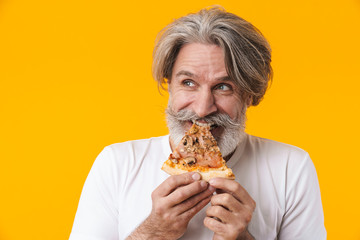 Emotional senior man holding pizza.