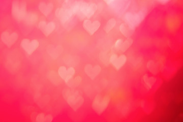 Red heat passionate and glamour bright bokeh background.Heart shaped bokeh red abstract background banner.  Love theme illustration. Valentines day concept. Copy space. Decorative glitter design.