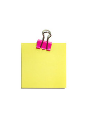 yellow paper with clip isolated on white background