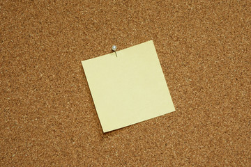 yellow blank note paper on bulletin board
