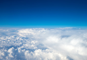 Fototapeta na wymiar Clouds, a view from airplane window. Sky background