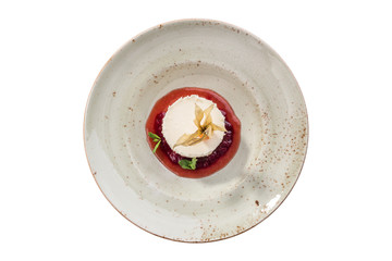 Small round New York cheesecake dessert with strawberry jam isolated on white background