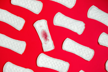 top view sanitary pads pattern  on a vibrant  red background