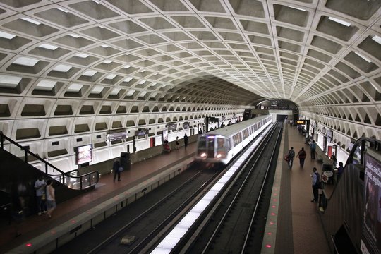 WASHINGTON, USA - JUNE 12, 2013: People wait for subway train in Washington. With 212 million annual rides in 2012 Washington Metro is the 3rd busiest rapid transit system in the USA.