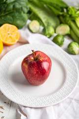 Apple on a white plate