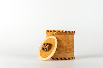 Basket of birch bark (Tuesok) with a lid on a white background. Food container