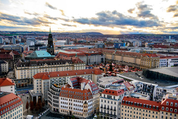 Panoramic view of Dresden city with old buildings at sunset from church of Our Lady Frauenkirche, Germany. November 2019