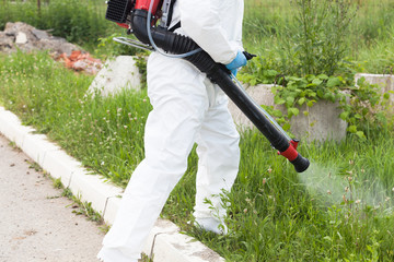 Pest control worker spraying insecticide