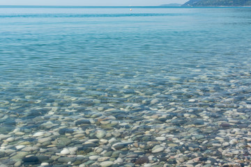 Clear seawater with a visible rocky seabed