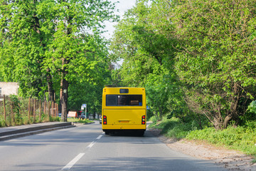 Fototapeta premium public transport bus rides in spring streets