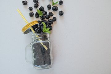 Fresh blackberries in a transparent glass