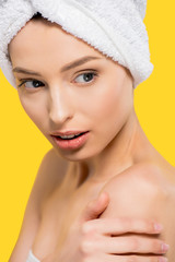 portrait of attractive girl with towel on head, isolated on yellow