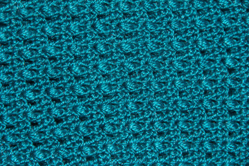 Texture of blue binding in holes. Knitted pattern. Original binding of the canvas.