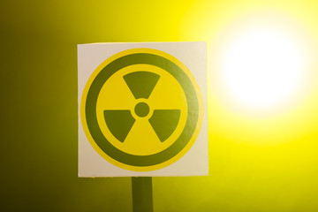Radiation and danger concept - Radioactivity sign and the dramatic smokey background