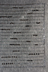 Rhinestones lines on the gray fabric