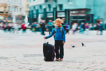 happy cute little boy with backpack travel in Vienna, Austria