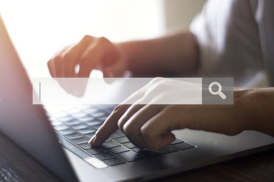 Searching Browsing Internet Data Information with blank search bar. Businesswoman working with laptop computer on desk in office. Networking Concept