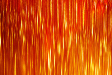 Abstract yellow orange vibrant pattern background. Flashes in the sun, liquid wall fire. Flowing hot lava colors paint