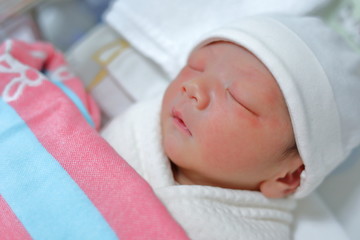 cute little newborn baby sleeping sweet dream in soft blanket