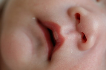 close up mouth and nose newborn baby softness sensitive skin