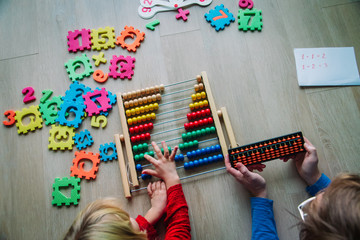 father with with little girl learning abacus calculation