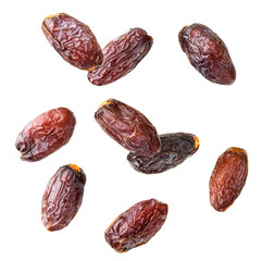 Dried dates fall on a white background. Isolated